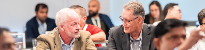 Energy leaders connecting during panel networking at Houston conference, Executives exchanging thoughts on automation and AI trends, Delegates building partnerships during AI in Energy conference